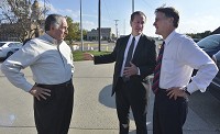 Vigo County Party Chairman Joe Etling, center,&nbsp; introduces Evan Bayh, right, to Terre Haute businessman Bill Maher during Bayh's visit Wednesday to his home turf. Staff photo by Jim Avelis