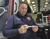Terre Haute Fire Department Capt. Robert Eberhardt shows a single dose of Narcan, an opioid neutralizer used in case of overdoses. Department personnel have used the drug 77 times since Jan. 1, 2016. Staff photo by Jim Avelis
