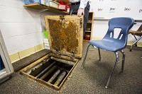 Green Valley Elementary School sits on top of a large crawl space that hold stagnant water. The pictured hatch is located in the corner of a classroom. Staff photo by Josh Hicks