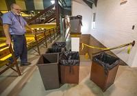 Jim Hunter, lead custodian at Mishawaka High School, shows where containers are being used to catch water leaking from the rook of the gymnasium Monday, Oct. 31, 2016. Staff photo by Robert Franklin