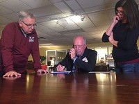 Mishawaka Schools Superintendent Dean Speicher (center) and board members Jeff Emmons (left) and Holly Parks take results for the school referendums Tuesday night, Nov. 8, 2016. Staff photo by Joseph Dits