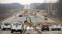 Construction crews work on building new inside lans for Interstate 69 outh of the Walnut Street/College Avenue interchange in Bloominton. Staff photo by David Snodgress