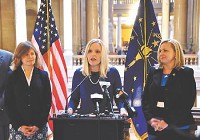 State Sen. Erin Houchin, R-Salem, center, details her bill to give domestic violence victims a separate phone accounty from their abusers. Joining her are Rep. Wenday McNamara, R-Evansville, right, and Rep. Carey Hamilton, R-Indianapolis. Staff photo by Scott L. Miley