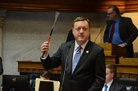 Sen. Eric Koch, R-Bedford, holds up a piece of fiber optic cable while discussing the need for broadband internet in rural areas at the Statehouse. Courtesy photo