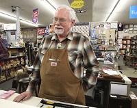 John Crane, owner of Crane's Leather and Shoes 1605 J. St., discusses the possible impact on his business of the upcoming downtown streetscape project which begins Monday. Staff photo by Garet Cobb