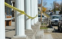 The pillars of a porch on a downtown building is lines with caution tape in Georgetown. A revitalization plan, approved by the town council, will focus on efforts to clean up some problematic areas downtown. Staff photo by Tyler Stewart