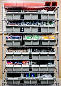 A cart with several bins holding supplies that aare to be handed out in the Clark County needle exchange program is shown in this file photo.