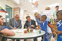 From left, donor John Lechleiter, Mayor Joe Hogsett and United Way of Central Indiana CEO Ann Murtlow talk with children at the Day Early Learning Lilly Family Center on Aug. 12, 2016, the day a $5 million gift from Lechleiter and his wife, Sarah, was announced. (Photo courtesy of United Way of Central Indiana)