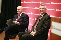 Indiana Gov. Eric Holcomb, right, answers questions from Indiana University President Michael McRobbbie during the America's Role in The World Conference at the IU School of Globaland International Studies. Staff photo by Jeremy Hogan