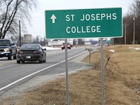 Signs point the way to Saint Joseph's College Friday, February 10, 2017, west of Rensselaer. Staff photo by John Terhune