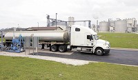 Trucks line up to unload corn at POET Biorefining Co. in Alexandria in this file photo. An average of about 110 trucks go through the facility daily. Because POET produces a product the produces carbon, it would be subject to a fee proposed by the Citizens' Climate Lobby. CNHI News Indiana photo