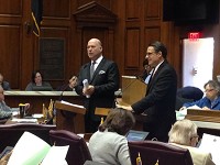 House Speaker Brian Bosma, R-Indianaolis, standing left, and House Democratic Leader Scott Pelath, D-Michigan City, debate Tuesday whether the state superintendent of public instruction should be an appointed or elected post.