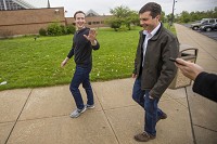 Facebook CEO Mark Zuckerberg (left) and South Bend Mayor Pete Buttigieg walk into the St. Joseph County Juvenile Justice Center during a surprise visit to South Bend on Saturday, April 29, 2017. Staff pphoto by Michael Caterina