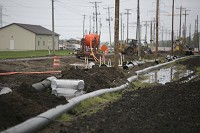 A water line is being installed near New Carlisle to support an industrial park planned by St. Joseph County. Staff photo by Santiago Flores