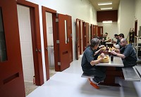 Male inmates eat lunch recently at the Porter County jail in Valparaiso. Staff photo by Jonathan Miano