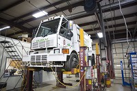 An Elkhart city street sweeper is on a lift inside the city's Central Garage on Thursday, May 4, 2017. Staff photo by Sam Householder
