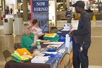 Tracie Isza, Human Resources Administrator, talks with Deante Davis during a job fair at Concord Mall Wednesday, May 10, 2017. Staff photo by Sam Householder