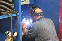 Welding classes at Ivy Tech in Goshen can set a prospective career welder on their way in less than a year, helping to fill a void of professional welder in the United States. Here welding instructor Edward Sexton demonstrates the process. Staff photo by David M. Palmer