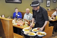 Participants in an Indiana-grown dinner at Monrovias Main Street Grill are served chicken, beef brisket and corn after eating hemp-infused salad. The meal was sponsored by the Indiana Hemp Industries Association and Indiana Farmers Union. CNHI News Service photo by Scott L. Miley