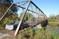 Bridge 45 pictured in this Oct. 14, 2015, file photo is expected to reopen to traffic by the end of July. The bridge over the West Fork of White River between Knox and Daviess counties, opened in 1903 and is one of the few iron-truss bridges left in Indiana.