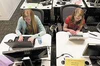 Jenny Hoelzer, left, and Michelle Hoelzer received Women in Tech scholarships to help pay for their coding class at Eleven Fifty Academy. (IBJ photo/Eric Learned)