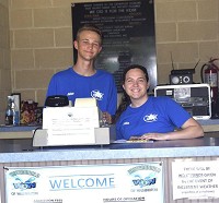 Julian Jerome Brown, left, and Callie Gray man the front desk at Washingtons city pool. Staff photo by Max Lancaster