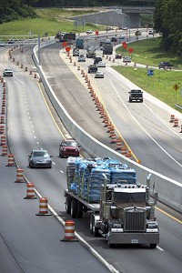 Traffic passes through a construction zone Monday on Ind. 37 as work continues on Section 5 of I-69 near the Ind. 45/46 Bypass in Bloomington. Staff photo by Chris Howell