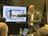 Rob Proctor of Ratio Architects at a meeting Wednesday shows the Vigo County Capital Improvement Board the interior design of a proposed Hulman Center renovation. Staff photo by Howard Greninger