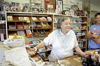 Shirley Campbell rings up purchases for customers on the final day the store in western Morgan County was open, Saturday, July 15, 2017. Staff photo by Alex Crowley