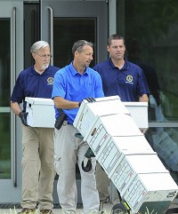 The FBI Evidence Response Team leaves the Terre Haute Wastewater Treatment Plant on Wednesday morning, July 19, 2017, laden with boxes of files dating back to 2013. Staff photo by Austen Leake
