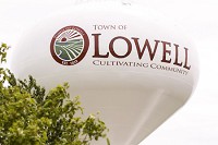 The water tower at Freedom Park in Lowell sports a new logo for the town. Staff photo by John J. Watkins