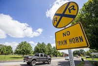 A railroad crossing sign says "No Train Horn" near the Ironwood Road crossing for the Grand Trunk Western Railroad Monday, July 24, 2017, in South Bend. Trains conductors began blowing horns at crossings in eastern South Bend on Saturday amid safety concerns. Staff photo by ROBERT FRANKLIN