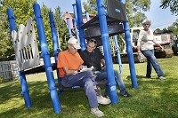 NEW EQUIPMENT:&nbsp;From left, Marion building commissioner Jerry Foustnight works with Garfield Neighborhood Association members Mike McAlister and Jan Bowen, and others, as relocated playground equipment is being installed in Barnes Park on Thursday.&nbsp; Staff photo by Jeff Morehead