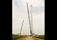 A crew prepares to hoist the blades of a wind turbine into the air Monday at a site east of county road 300 East just north of the Jay/Randolph county line. As of Thursday evening, 31 of the 57 turbines that will be part of Bluff Point Wind Energy Center had been erected. (The Commercial Review/Ray Cooney)