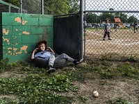 Jamison Heitger fights off boredom as he waits for his turn to bat during his last little league baseball game of the season held at the Scott Township Baseball fields in Evansville, Indiana, June 5, 2017.&nbsp; Staff photo by SAM OWENS | Evansville Courier &amp; Press