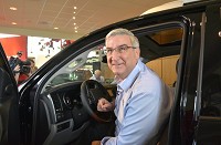 Gov. Eric Holcomb checks out the new Sequoia Platinum her purchased Wednesday. The SUV was on display as Toyota's 5th million vehicle came off the line at the Gibson County plant. Staff photo by Andrea Howe