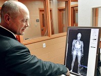 Hamilton County Jail Commander Capt. Jason Sloderbeck explains how to identify contraband in a full body scan of a jail inmate. Staff photo by Stuart Hirsch
