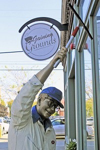 Bob, the name of the man depicted in this Seward Johnson sculpture in downtown Goshen, is placed so it seems he is washing a window at Gaining Grounds.&nbsp; The sculpture's actual title is&nbsp;Have a nice day. Staff photo by Roger Schneider