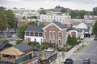 New apartments can be seen rising over downtown Bloomington in this photo taken Aug. 29 from atop the parking garage at Seventh and Walnut streets. A recent study commissioned by the city says Bloomington will need 13,600 more housing units before 2030. Staff photo by Chris Howell