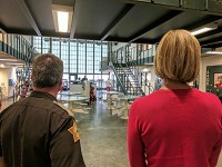 Vanderburgh Co. Sheriff Dave Wedding and Lt. Gov. Suzanne Crouch (right) look at the women's area of the county jail Monday morning. The section of the jail is designed to hold 64, but more than 80 are lodged there now. The jail itself is almost 150 over people capacity. Staff photo: Zach Evans, Courier &amp; Press