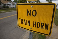 A sign near the tracks just south of Jefferson Street near the 26th street intersection informs motorists that trains in that area do not sound horns when approaching crossings. Federal regulators have reinstated so-called "quiet zones" at the city's railroad crossings for trains in South Bend. Tribune Photo/MICHAEL CATERINA