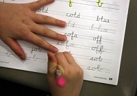 A student practices cursive writing at Simatovich Elementary School in Union Township in this 2011 file photo. Times of Northwest Indiana staff file photo by John Luke