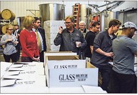 Huber&rsquo;s President Ted Huber leads Lt. Gov. Suzanne Crouch and State Rep. Ed Clere through the bottling and packaging facility on site at Huber&rsquo;s Orchard and Winery on Friday, Dec.1, 2017. Staff photo by Tyler Stewart