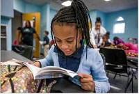 
Morris Love, 7, reads inside of the Boys and Girls Clubs of St. Joseph County&rsquo;s main campus in South Bend. Staff photo by Robert Franklin

