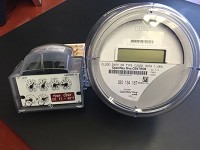 &nbsp;
At right is the "smart meter" Vectren will be installing for customers across its service area in 2018. At right is an encoder receiver transmitter, which those with natural gas meters also will receive.(Photo: John Martin, Courier &amp; Press)