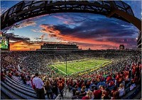 The sun sets over Notre Dame stadium before kickoff of the Notre Dame-Southern California game Oct. 21 in South Bend. The new tax bill set to become law when signed by President Donald Trump will eliminate the 80 percent deduction sports fans may take for seat-license fees. Tribune Photo/ROBERT FRANKLIN