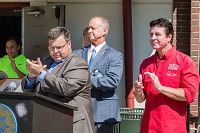 Papa John's Pizza founder John Schnatter claps alongside Jeffersonville mayor Mike Moore and president of the parks authority, Bill Burns, in August 2017. Schnatter is stepping down as CEO of Papa John's Pizza, effective Jan. 1, 2018. Staff photo by Josh Hicks