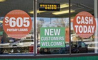 New payday loan rules which passed the state House this week would establish longer-term loans for between $605 and $1,500. Pictured is CheckSmart payday loans on Michigan Street in South Bend. Tribune Photo/ROBERT FRANKLIN