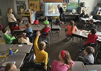 Kim Simpson, a docent with the Indiana University Eskenazi Museum of Art, gives a presentation to Nancy Gross' second-grade class at Edgewood Primary School in Ellettsville. Staff photo by Chris Howell.