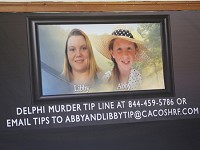 Posters of slain Delphi teens Liberty German and Abigail Williams serve as a backdrop for a press conference for the latest updates on the investigation of the girls deaths Thursday, March 9, 2017, at Carroll County Courthouse in Delphi. The two Delphi teens who were hiking the Delphi Historic Trails on February 13, were found dead a day later. Staff photo by John Terhune